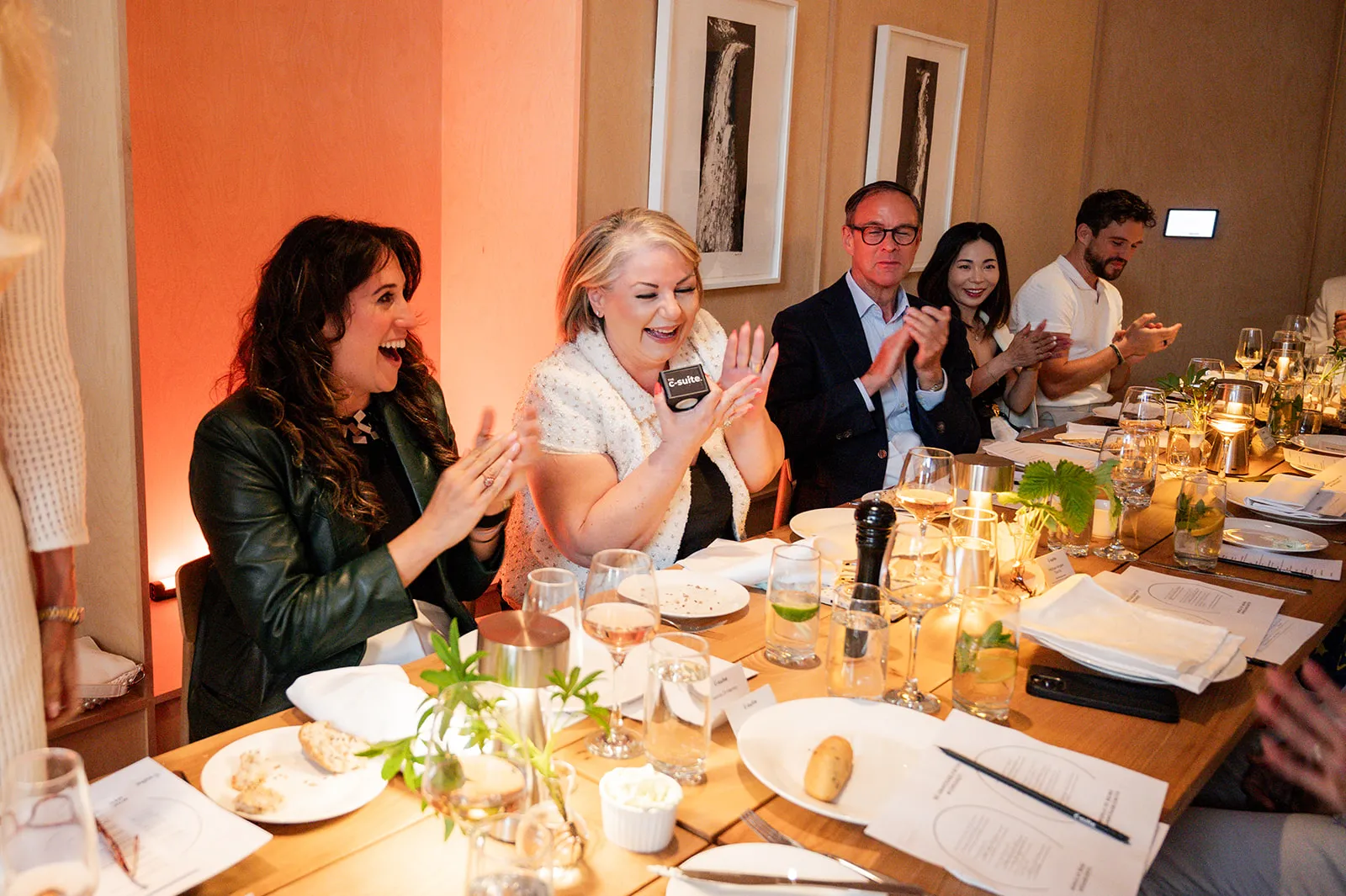 A sophisticated event in progress, with guests engaged and appreciating the proceedings.